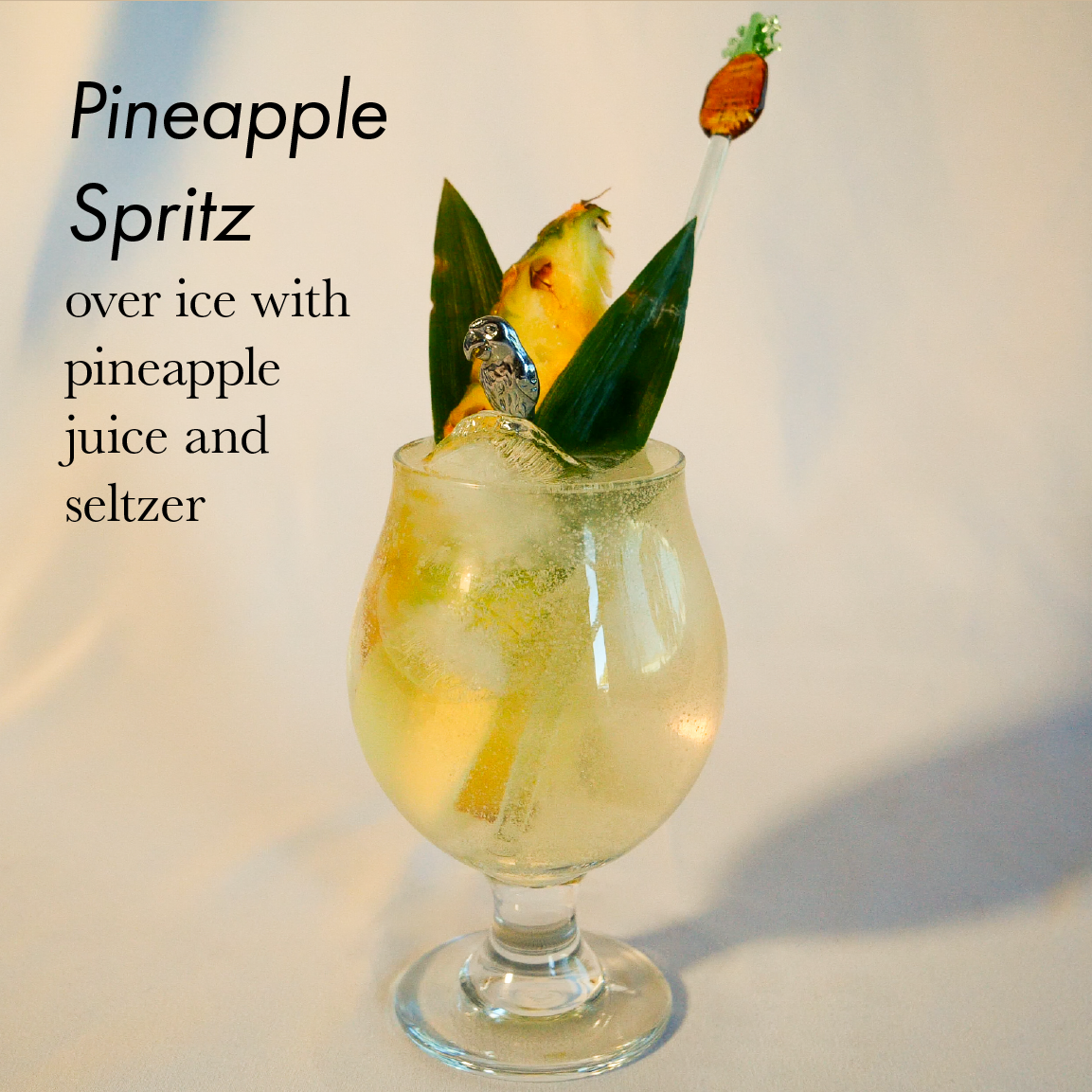 Pineapple spritz over ice with pineapple juice and seltzer