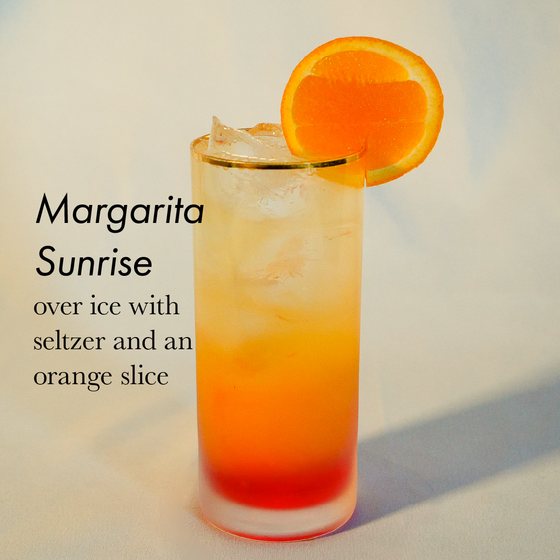 Margarita Sunrize in a glass with an orange slice